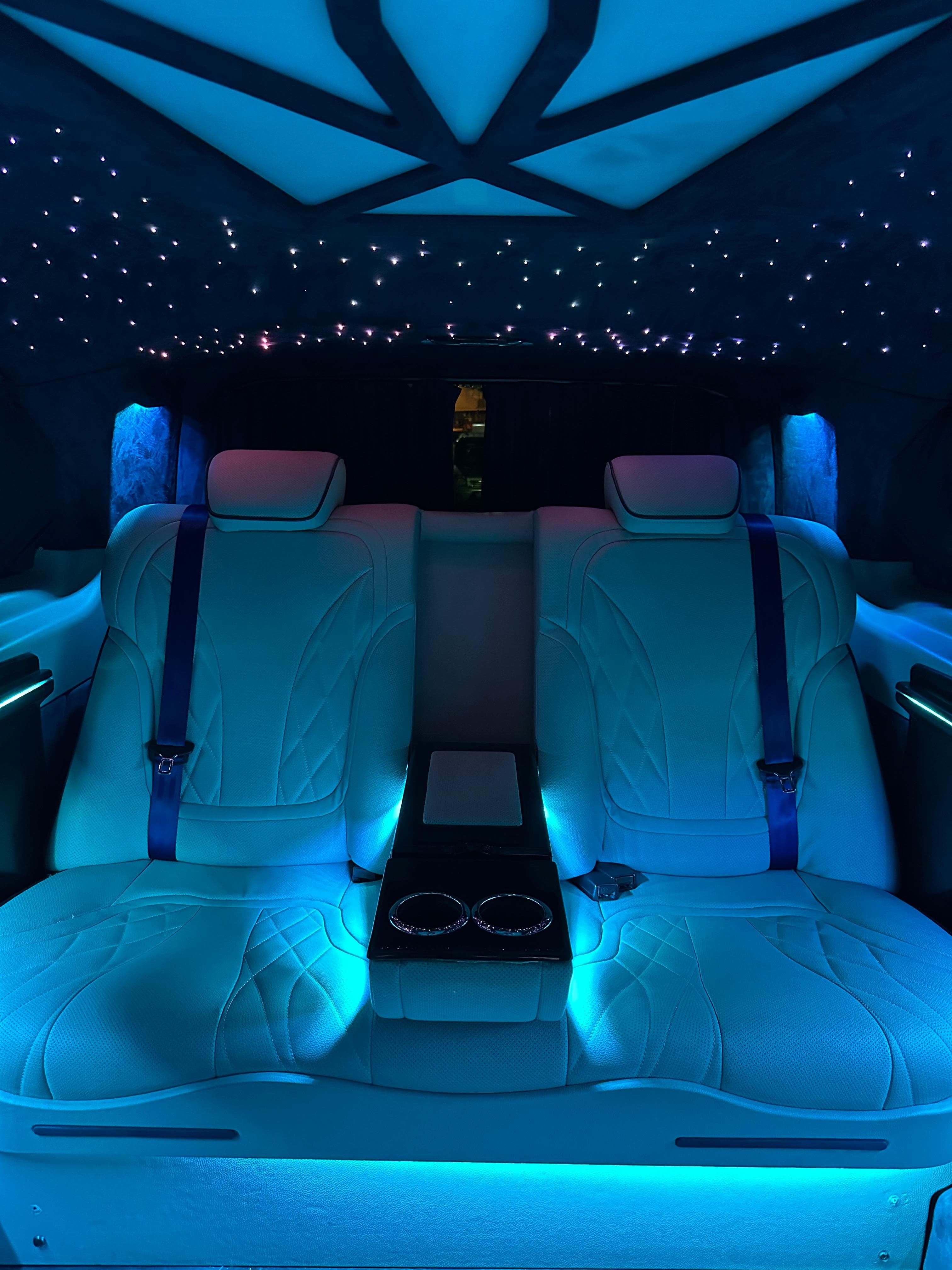 Blue ambient lighting in luxury car interior